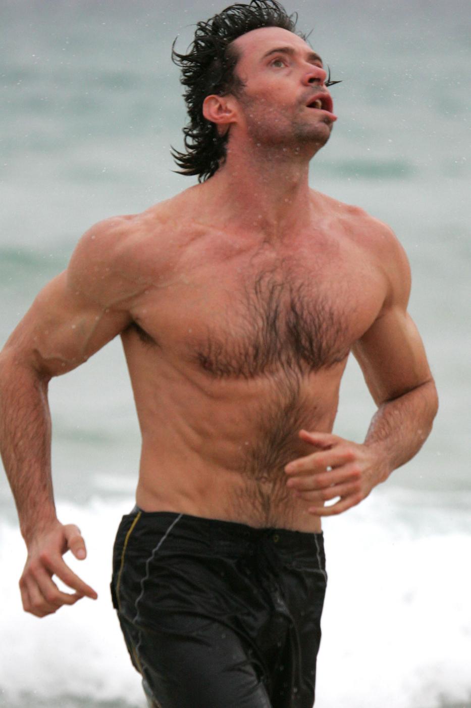 Hugh Jackman shows off his muscles during an early morning dip at Bondi Beach