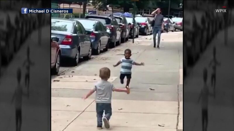 Toddlers going in for a hug