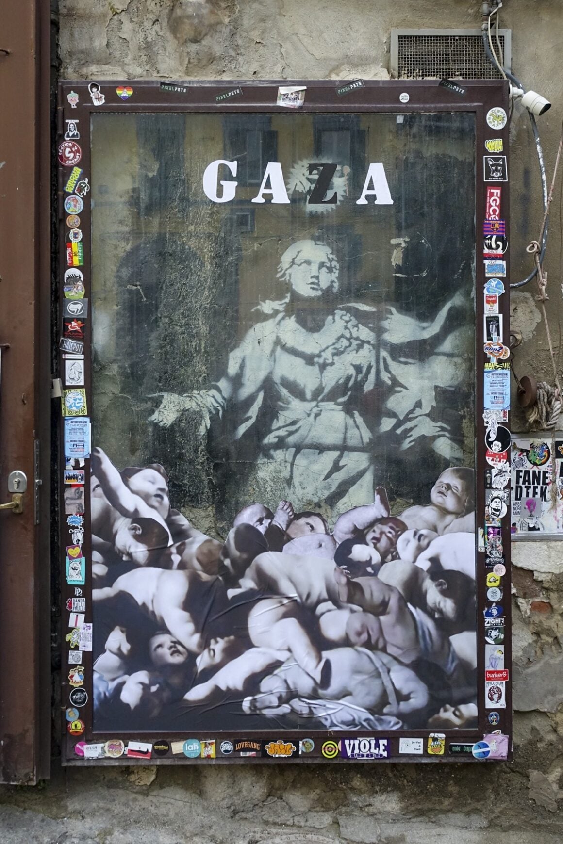 Banksy's 'Madonna With A Gun' Covered In Pro-Gaza Stickers