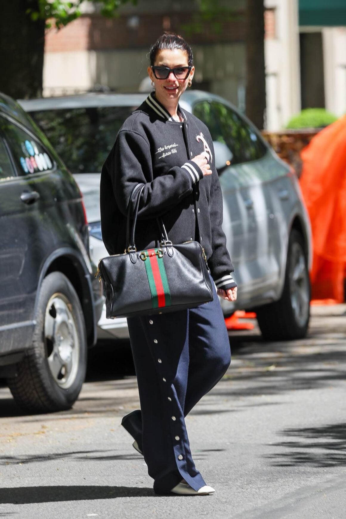 Anne Hathaway flashes a big smile during NYC outing as she is seen sporting a Gucci bag and Armani loafers