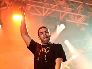 Singer Songwriter Drake live in concert on stage with backing band