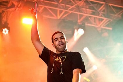 Singer Songwriter Drake live in concert on stage with backing band