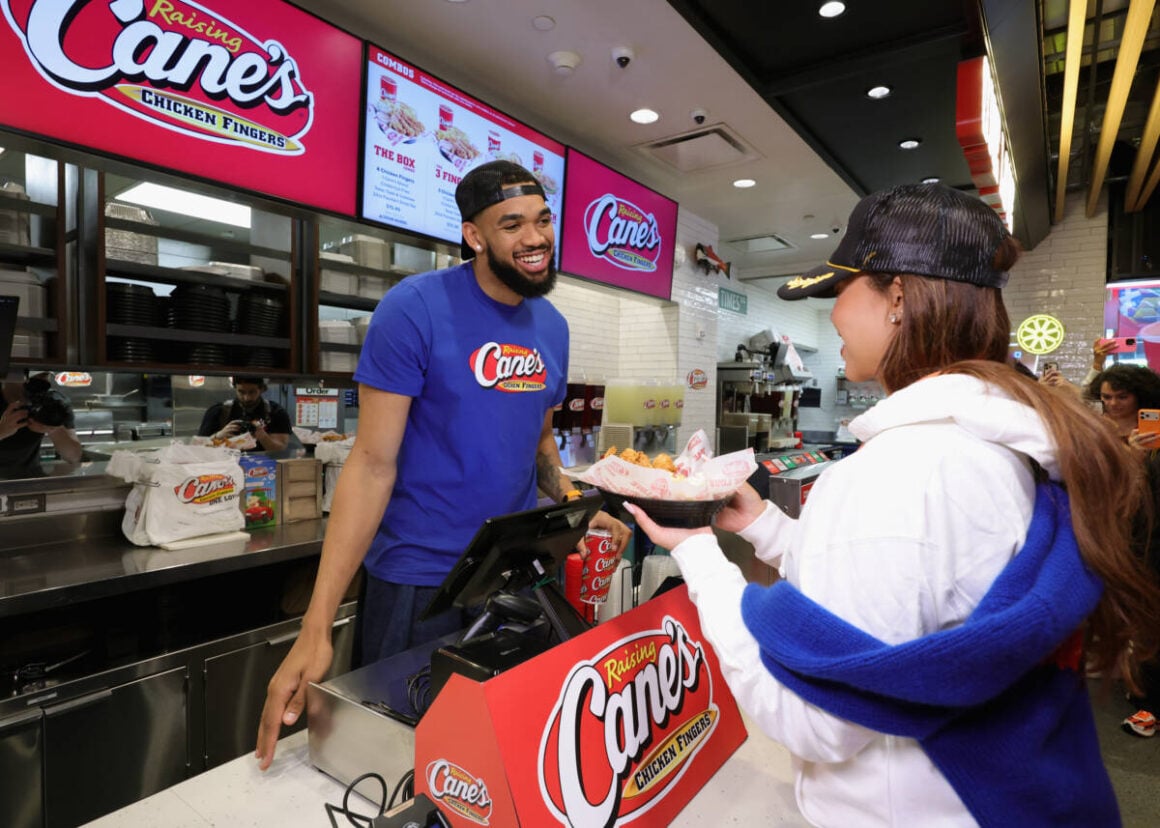 Basketball Champion Karl-Athony Towns Works Victory "Shift" At Raising Cane's Global Flagship In Times Square