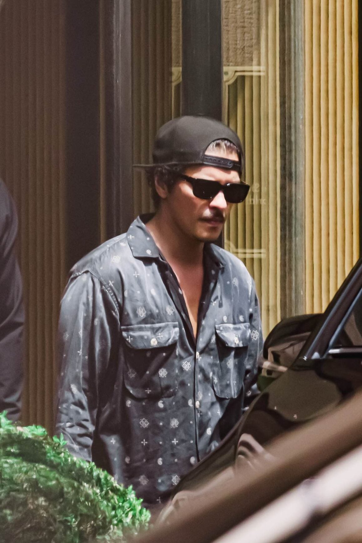Bruno Mars Leaves His Hotel In Milan