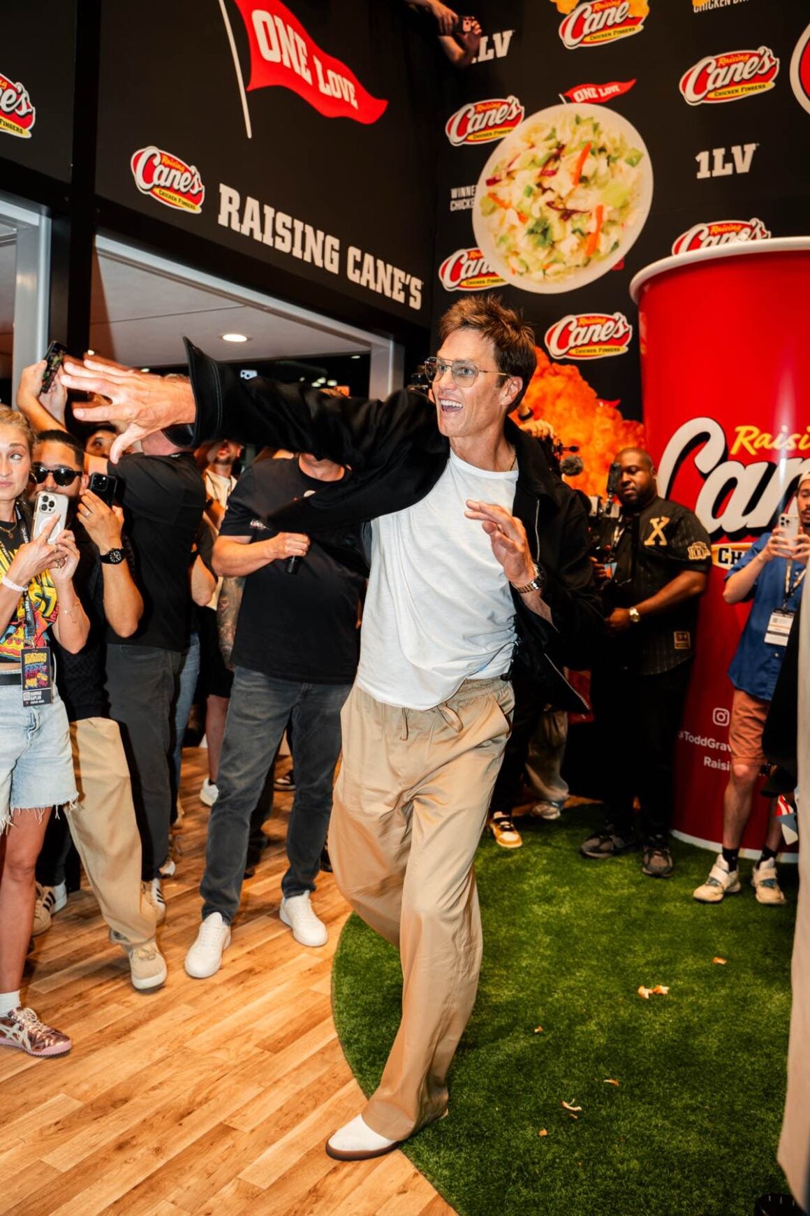 Raising Cane's Owner And Founder Todd Graves Hosts Cane's Sauce Dunk Tank Showdown With Tom Brady And Rob Gronkowski At Fanatics Fest